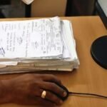 Tribal council officials digitising land records in Odisha landscape