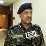 Odisha police personnel conducting security operations in a rural district landscape
