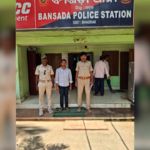 Police officers standing outside a police station in Odisha