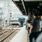 Passengers waiting on a crowded train station platform
