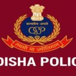 Police officers in uniform holding seized cannabis